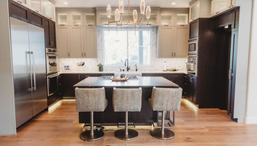 Renovated kitchen with stainless steel fridge on the left